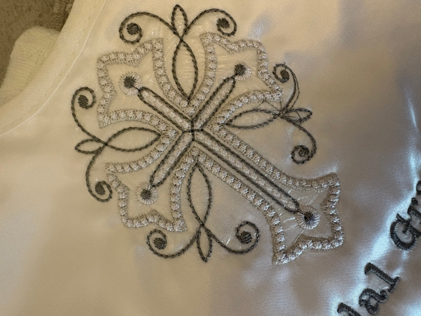 Close up of embroidered cross