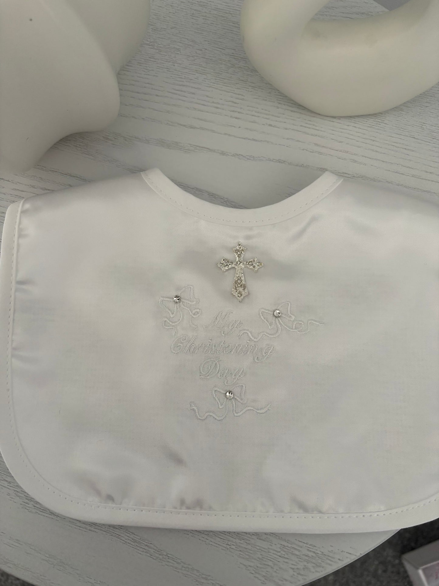 White Satin Christening Bib with a Rhinestone Cross