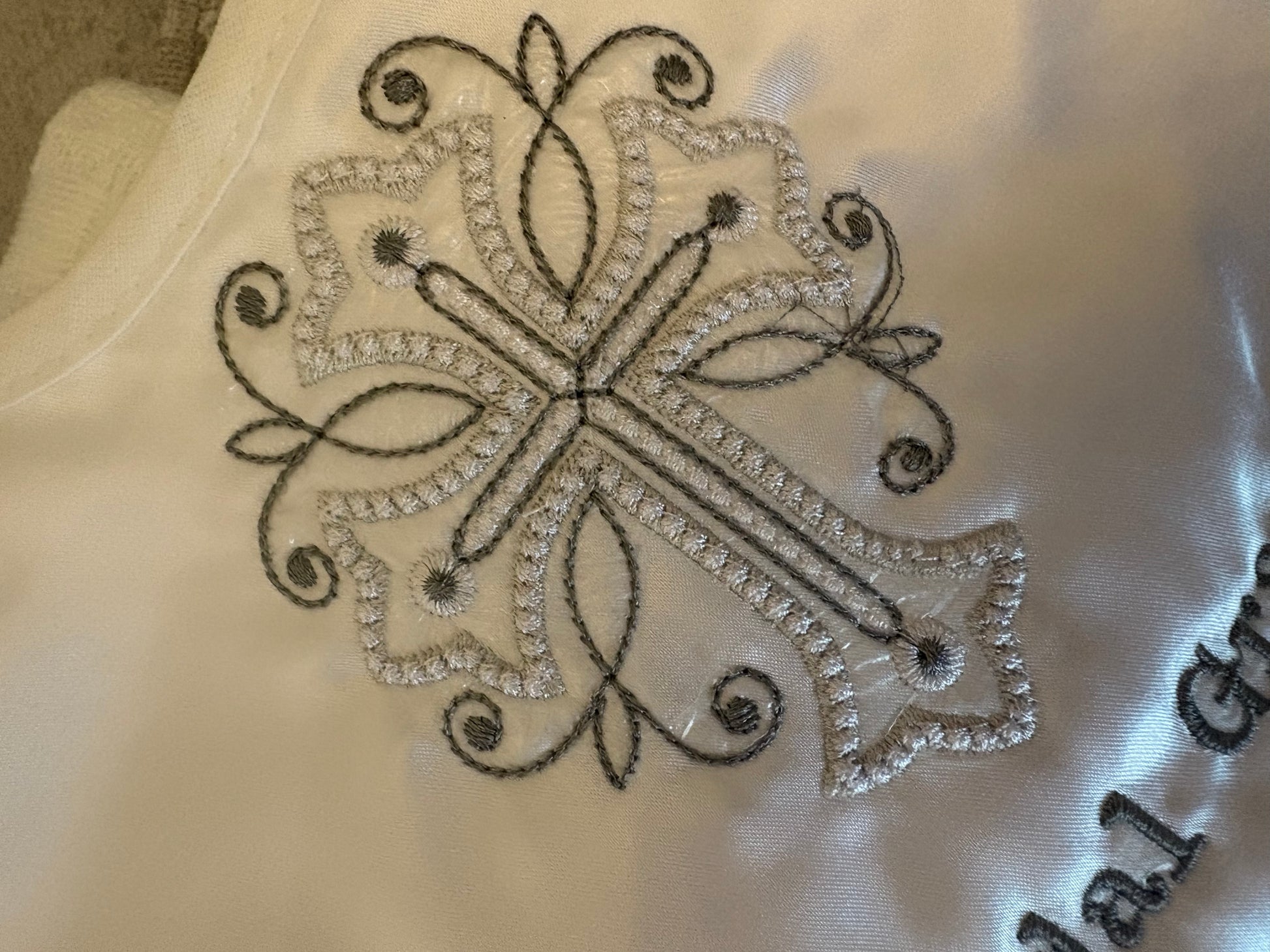 Close up of embroidered cross