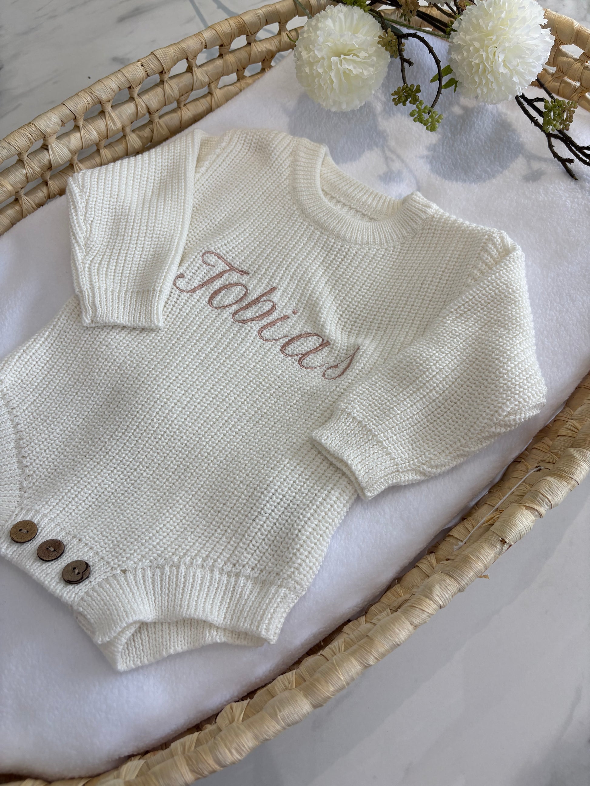 Ivory Personalised knitted baby romper with embroidered name in taupe.