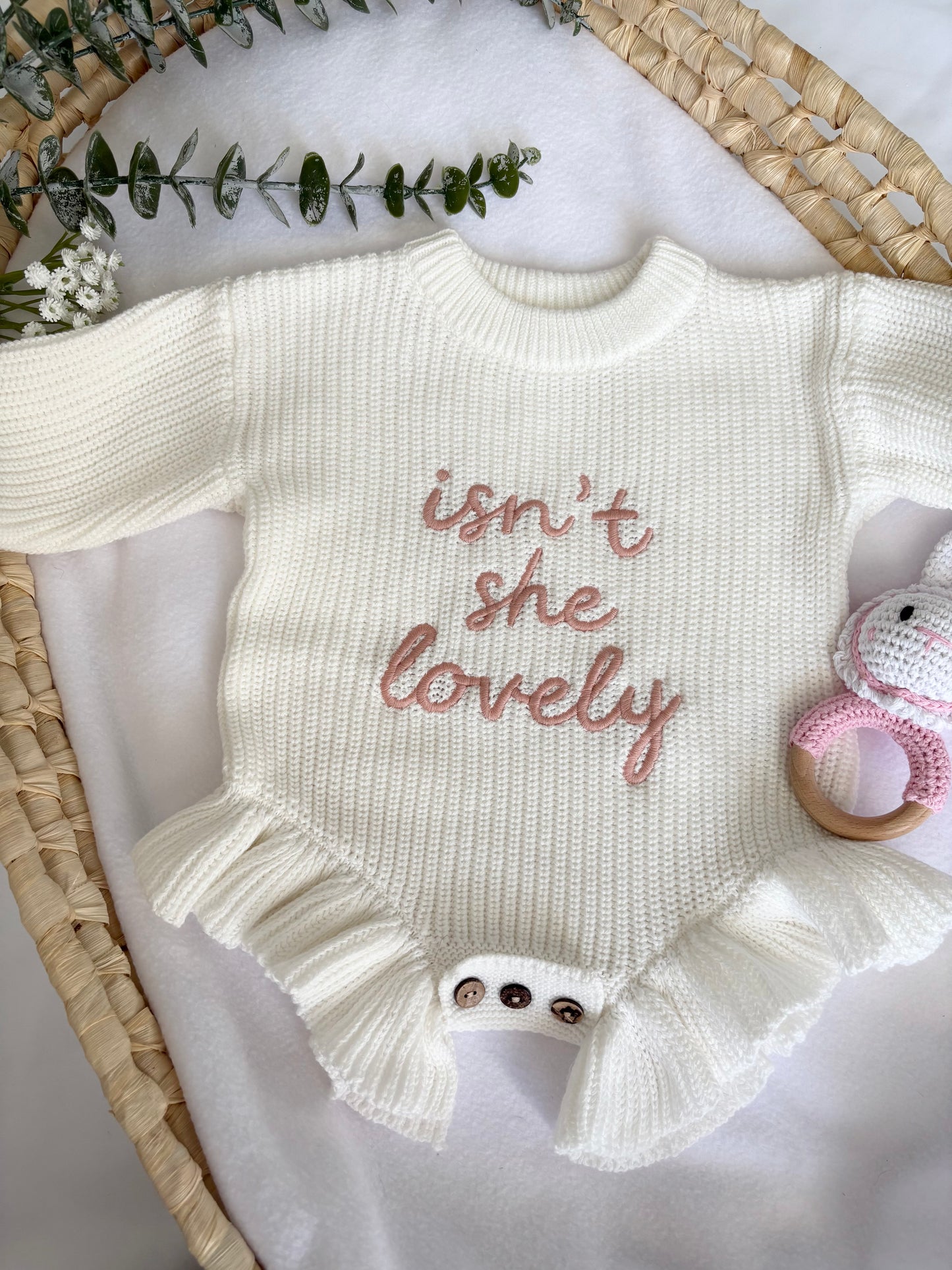 Baby knitted romper with 'isn't she lovely' embroidered .