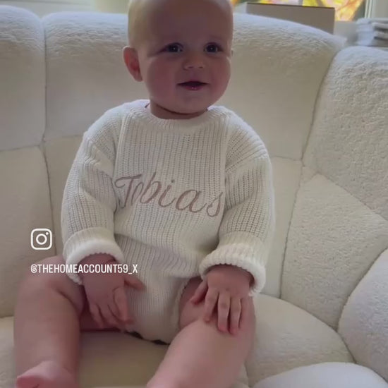 Knitted baby romper available in multiple colours