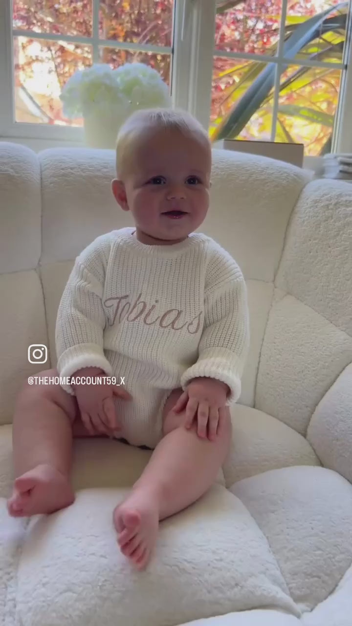 Knitted baby romper available in multiple colours